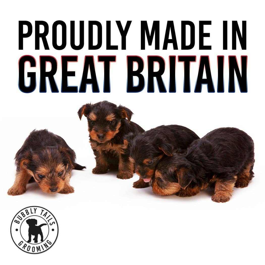Four small puppies lying on white background with HugglePets Bubbly Tails Dog Cologne branding and "Proudly Made in Great Britain" text