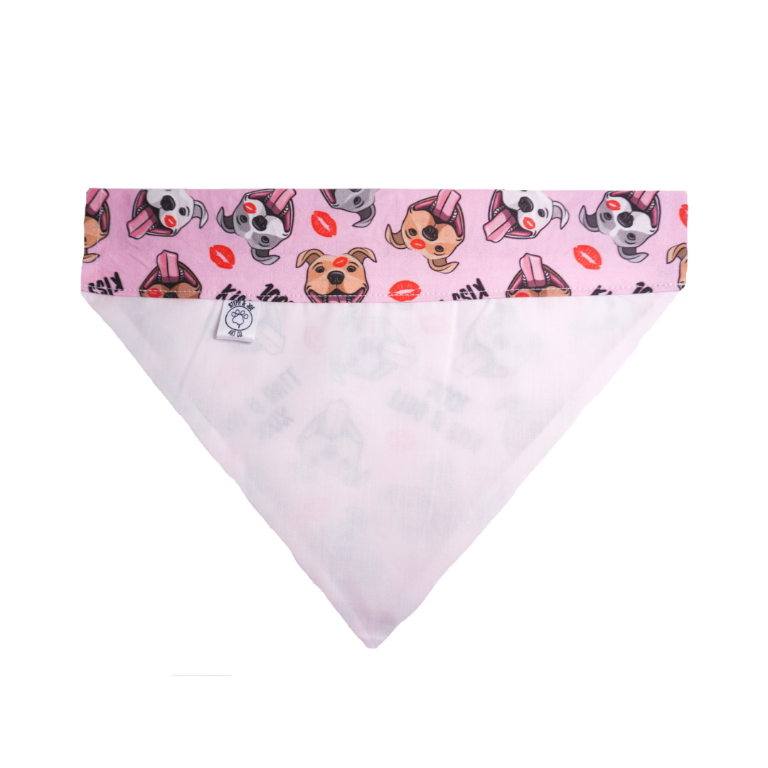 Pink dog bandana with playful dog and kiss print, 100% cotton, breathable and easy loop design for collars.