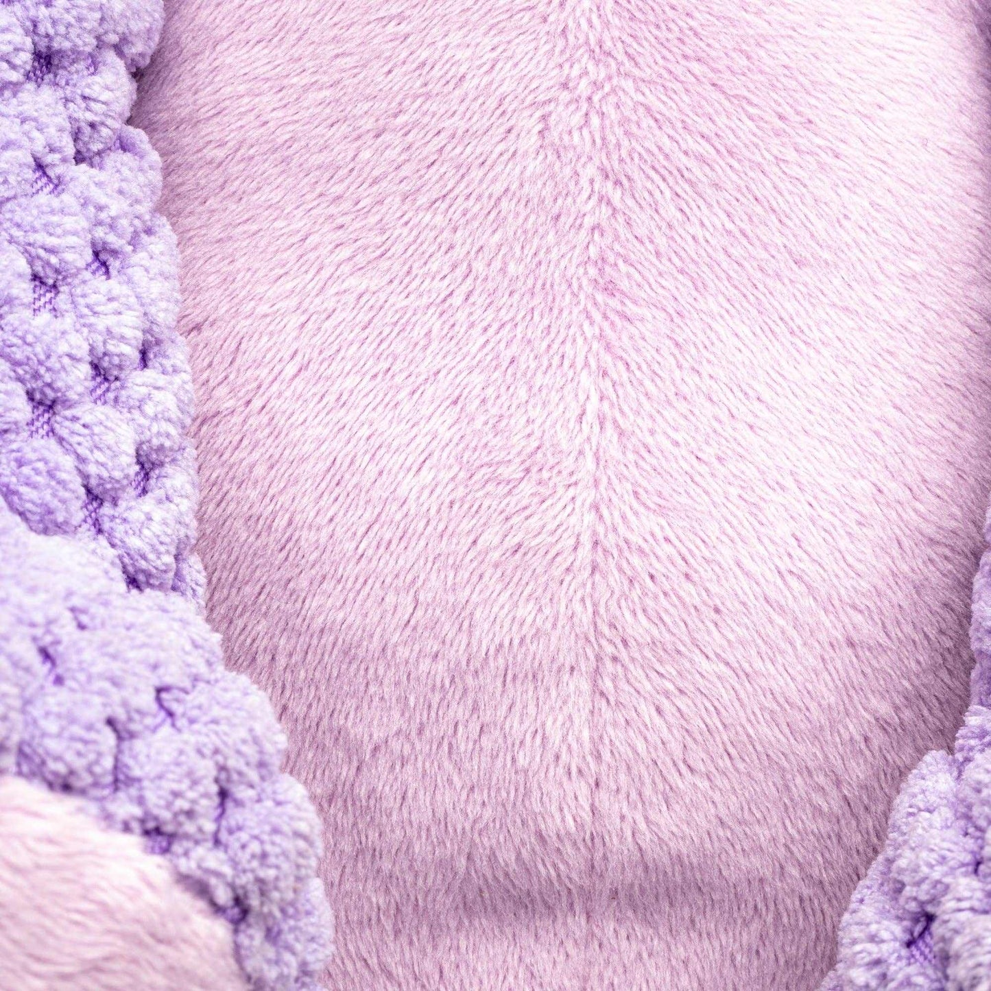 Close-up of soft fabric texture on Floppy Hippo Plush Dog Toy in light purple with knitted details