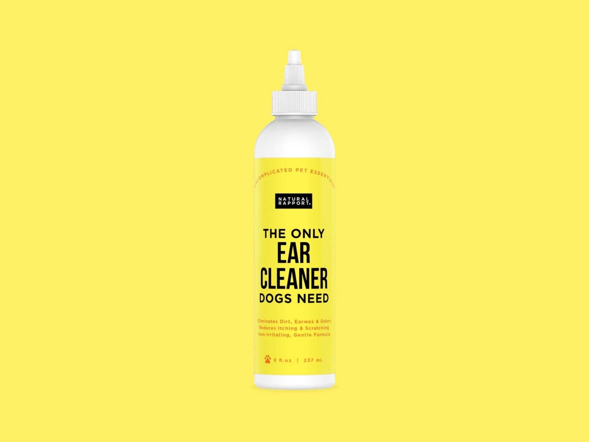 Natural Rapport Ear Cleaner Dogs solution bottle on yellow background for gentle ear care and infection prevention