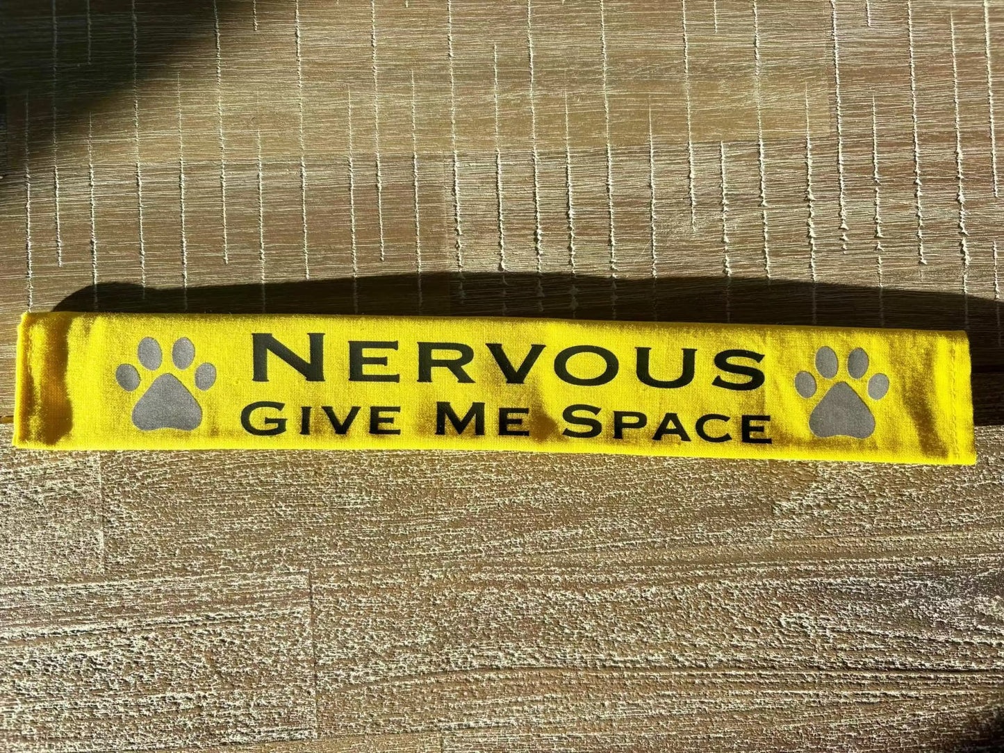 Yellow reflective lead slip for dogs with "Nervous Give Me Space" text and paw prints for safety and communication.