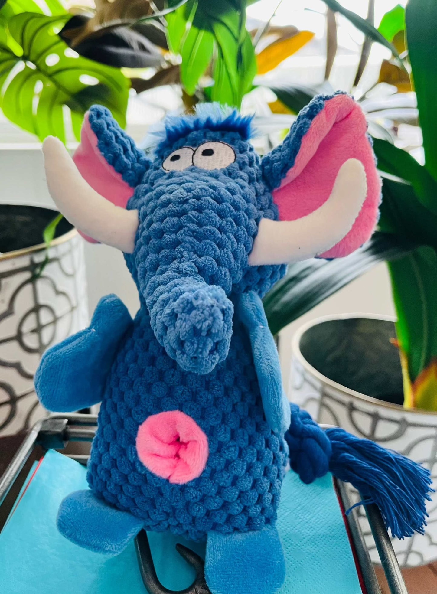 Blue interactive plush elephant dog toy with rope tail and crinkle ears