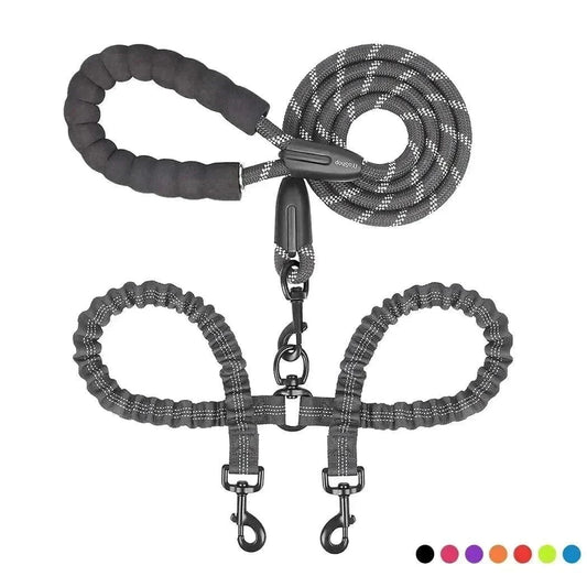 Dual bungee rope lead for two dogs with shock-absorbing extension and comfort-grip handles