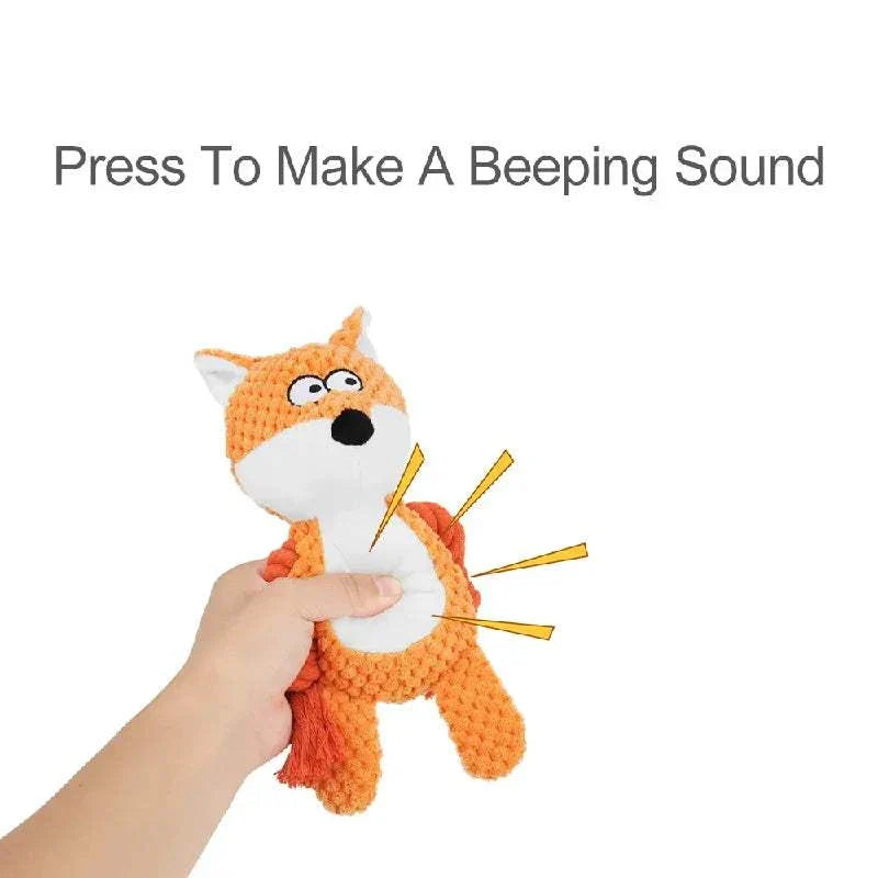 Hand holding cute orange animal rope squeak plush toy for dogs and puppies with beeping sound feature