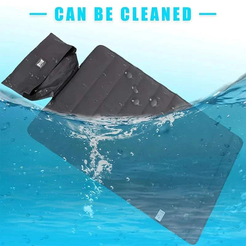 Foldable premium waterproof pet blanket in dark grey submerged in water showcasing easy cleaning and leak protection