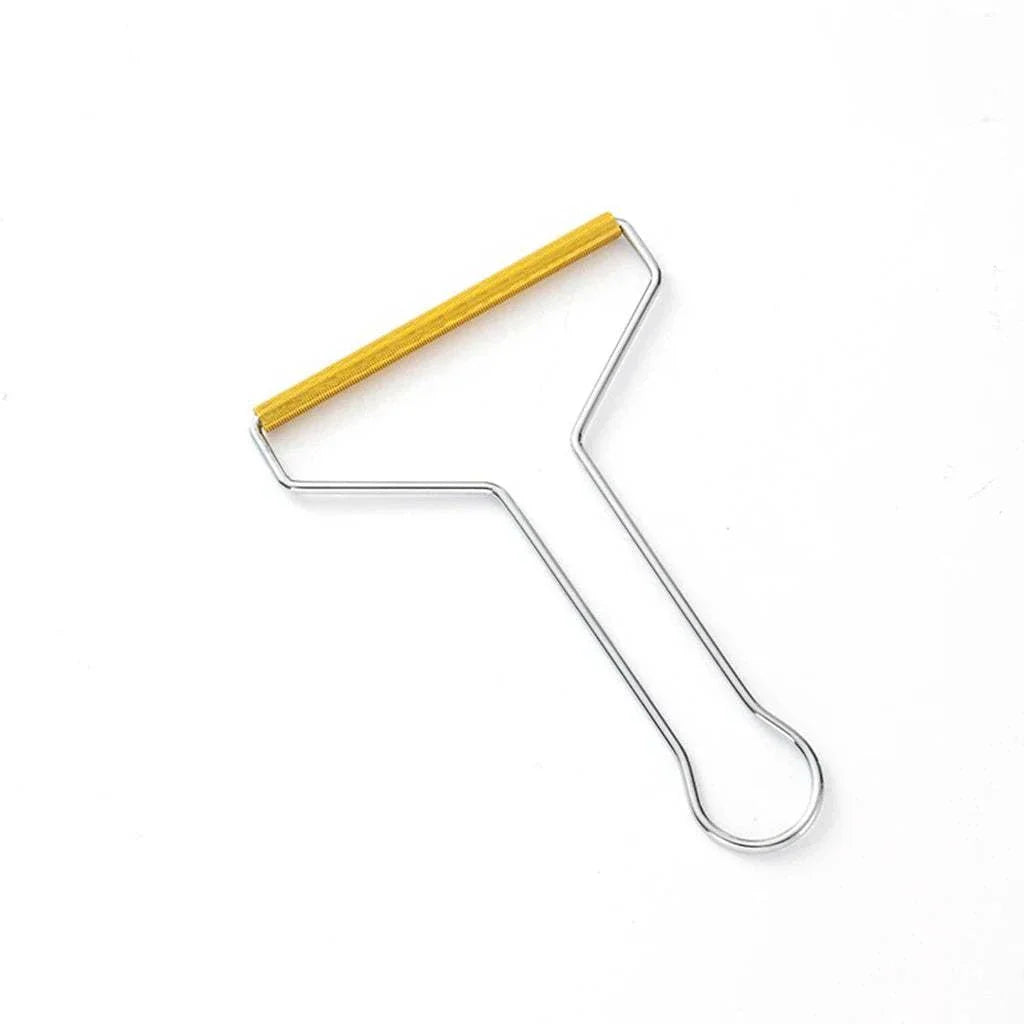 Compact metal pet hair remover tool with yellow handle for fabric cleaning