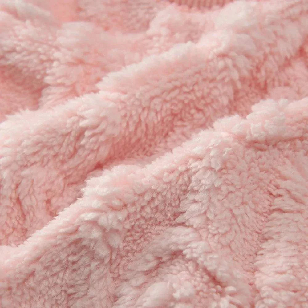 Close-up of soft cozy fleece sweatshirt fabric in light pink for pet clothing