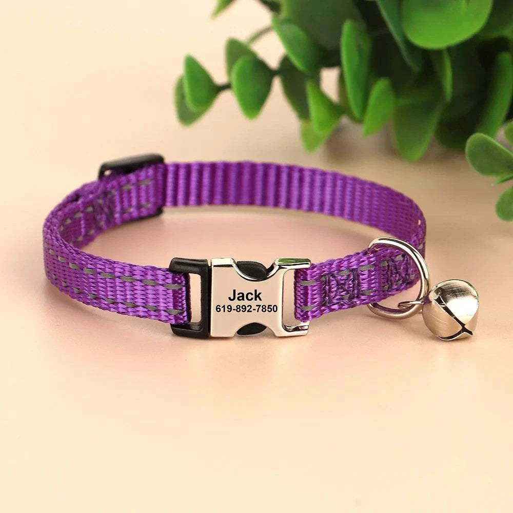 Personalised reflective purple cat and small dog collar with engraved name and phone number, featuring a bell charm for safety and visibility.