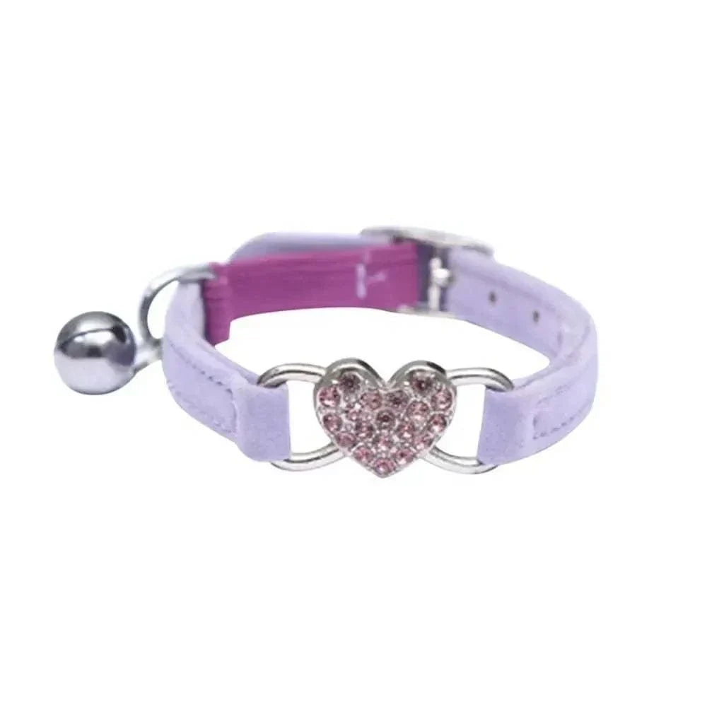 Pretty Kitty's adjustable cat collar with pink heart-shaped bell and purple strap for safety and style