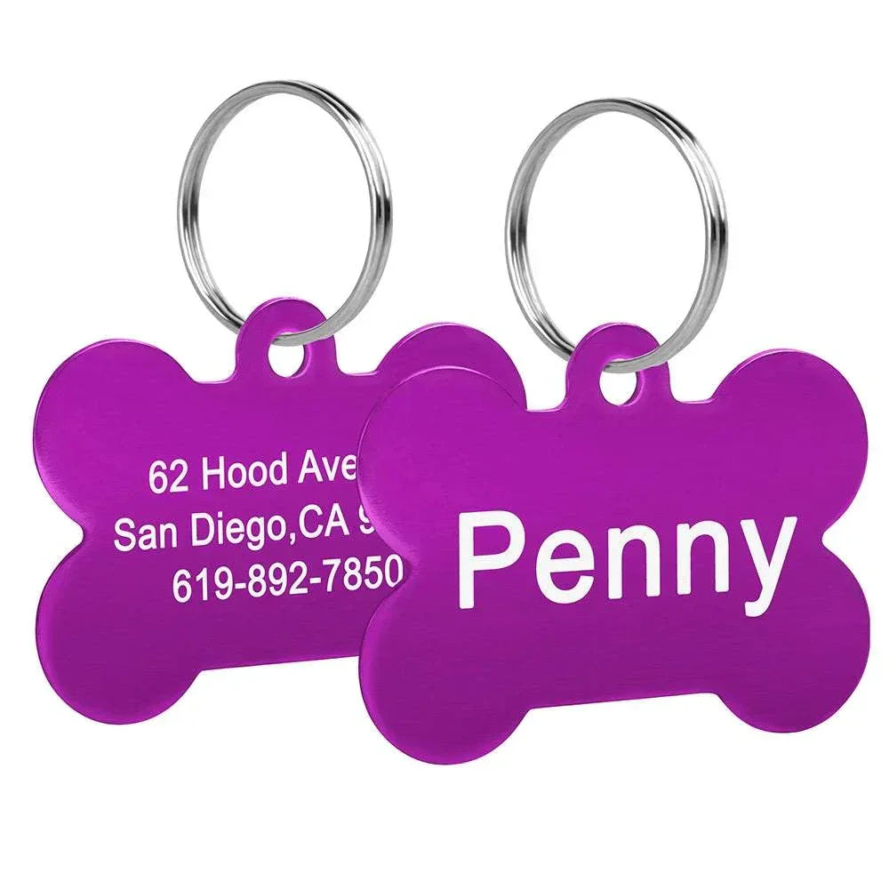 Purple bone-shaped pet ID tags with personalized engraving for name and contact details