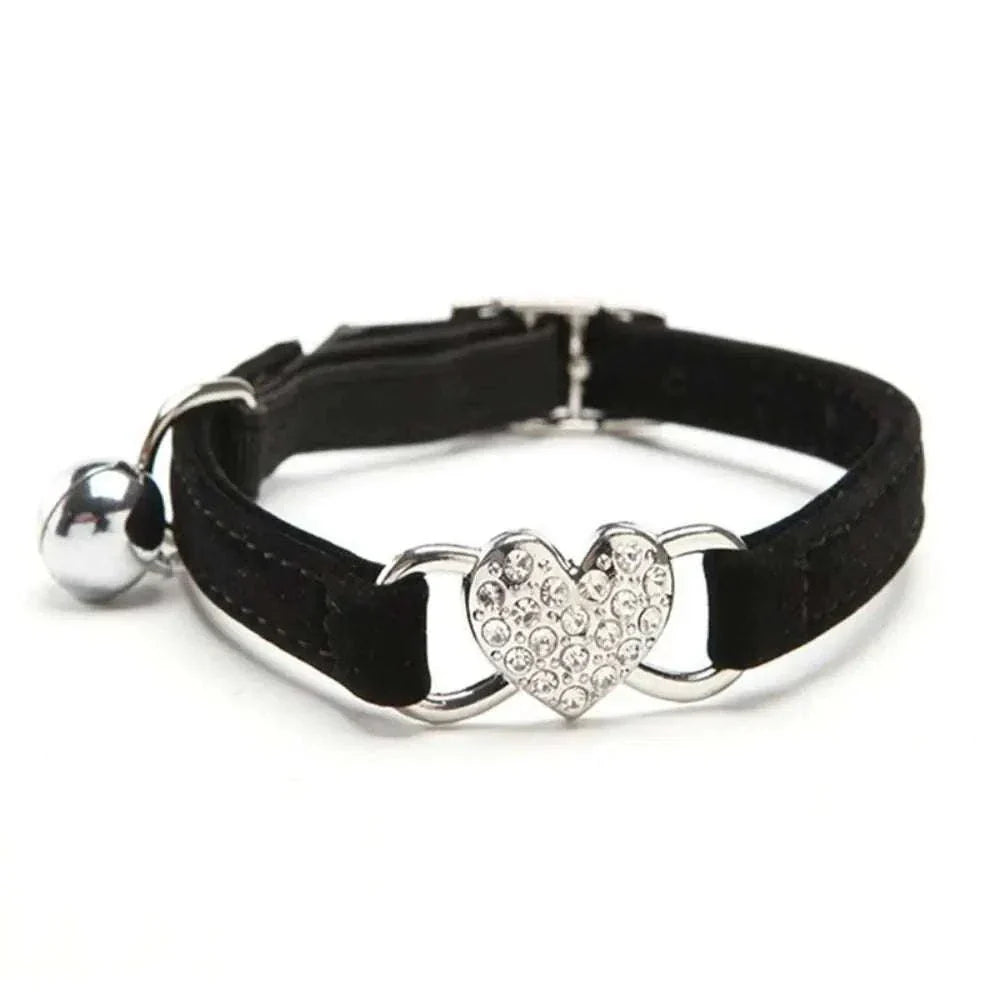 Pretty Kitty's adjustable black cat collar with sparkling heart-shaped bell and silver hardware for safety and style