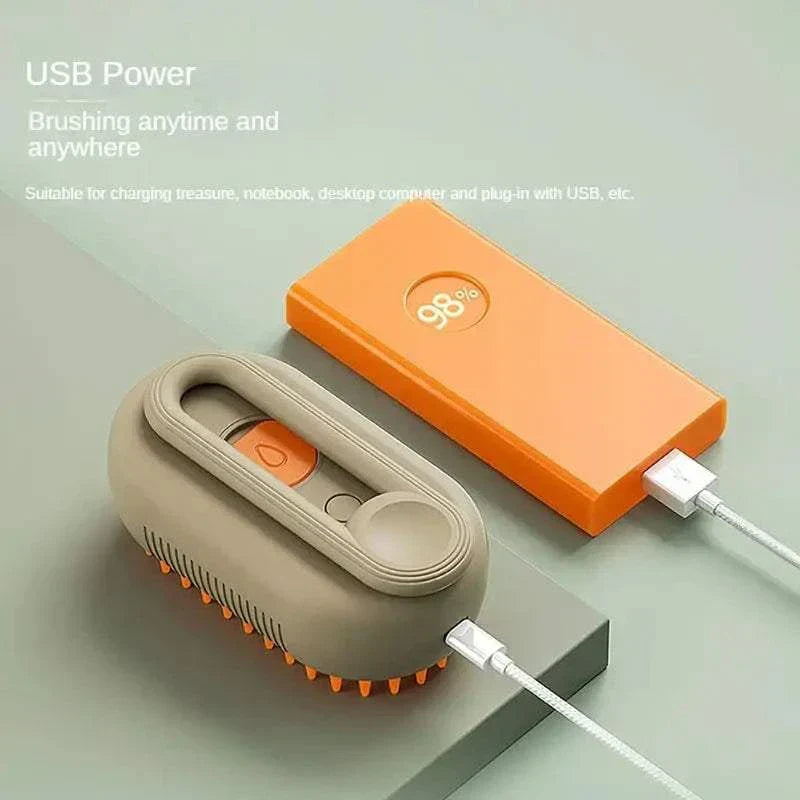USB powered Steam Pet Brush grooming tool for dogs and cats with ergonomic handle and soft bristles