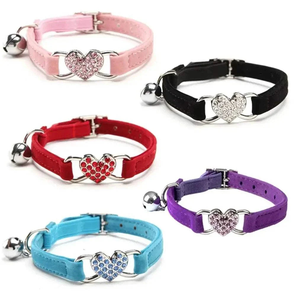 Pretty Kitty's adjustable cat collars with heart-shaped bells in pink, black, red, purple, and blue colors for pet safety and style