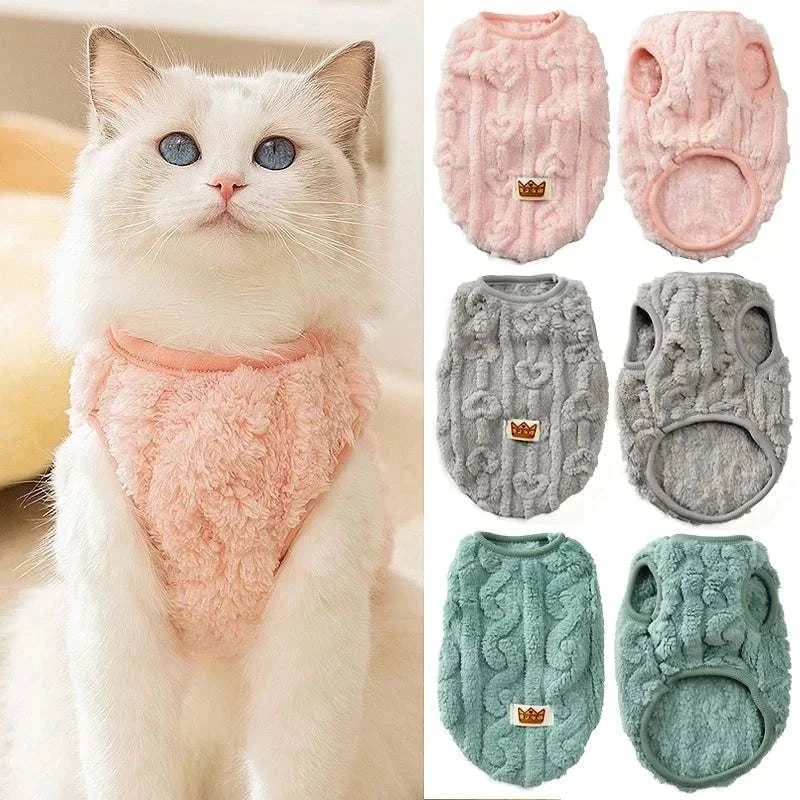 Cat wearing soft cozy fleece sweatshirt in pink with additional pink, gray, and green fleece sweatshirts displayed