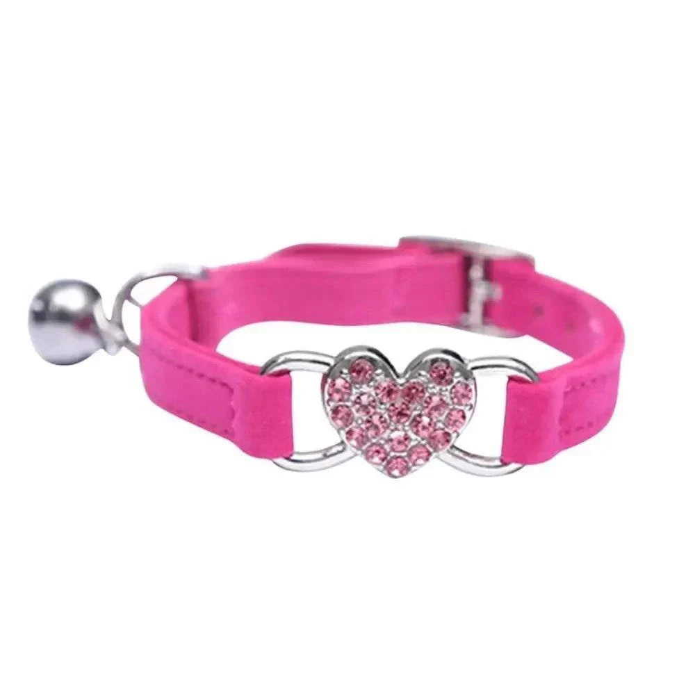 Pretty Kitty's adjustable pink cat collar with heart-shaped diamond bell and silver buckle