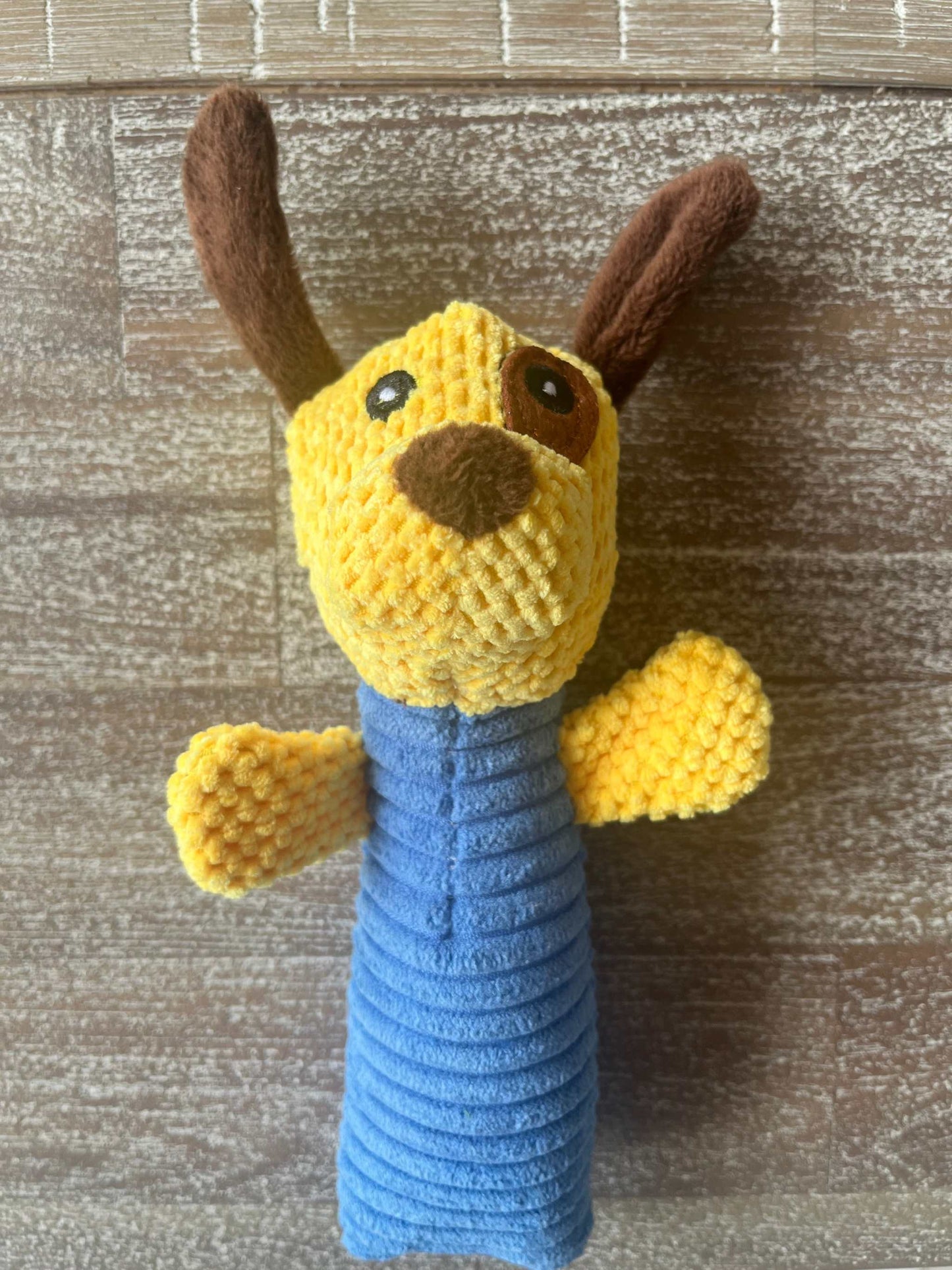 Cute squeeker toy for small dogs in yellow and blue resembling a puppy with soft textured fabric and squeaker inside
