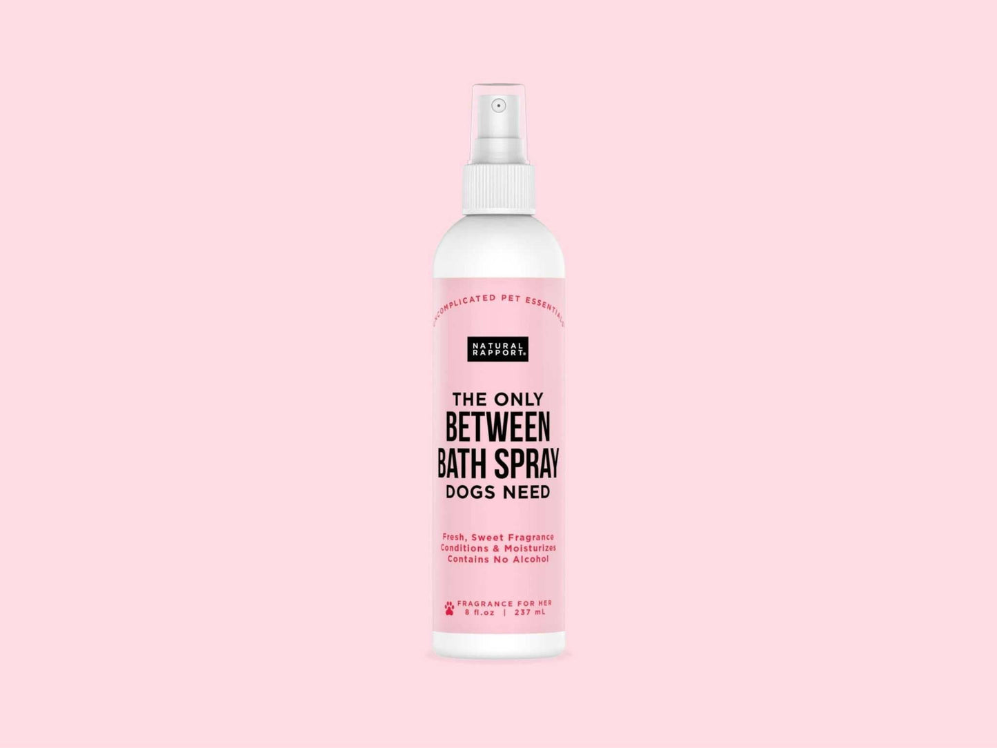 Natural Rapport Bath Spray for Dogs bottle on pink background.