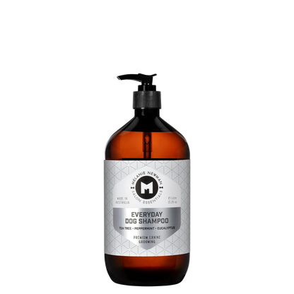 Melanie Newman Everyday Dog Shampoo with Tea Tree, Peppermint, and Eucalyptus in amber bottle.