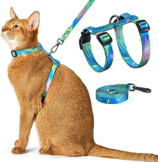 Cat wearing blue floral adjustable harness and leash set with 360-degree swivel clasp for outdoor safety and comfort