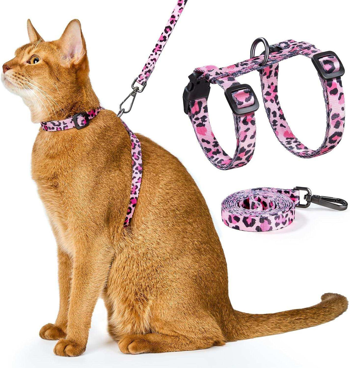 Cat wearing pink leopard print cat harness and leash set with adjustable straps and 360-degree swivel clasp on white background