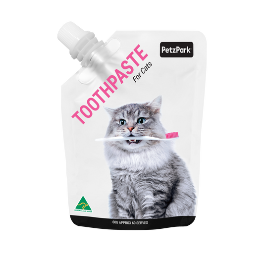 PetzPark Toothpaste for Cats 60g pouch with gray cat holding pink toothbrush promoting dental care with natural ingredients.
