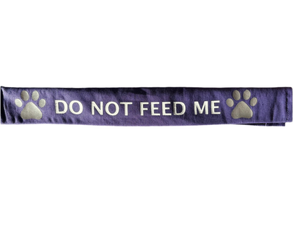 Purple lead slip for dogs with "DO NOT FEED ME" text and reflective paw prints for safety and communication.