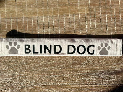 Customizable white cotton lead slip for dogs with "BLIND DOG" text and paw prints, designed for safety and communication.