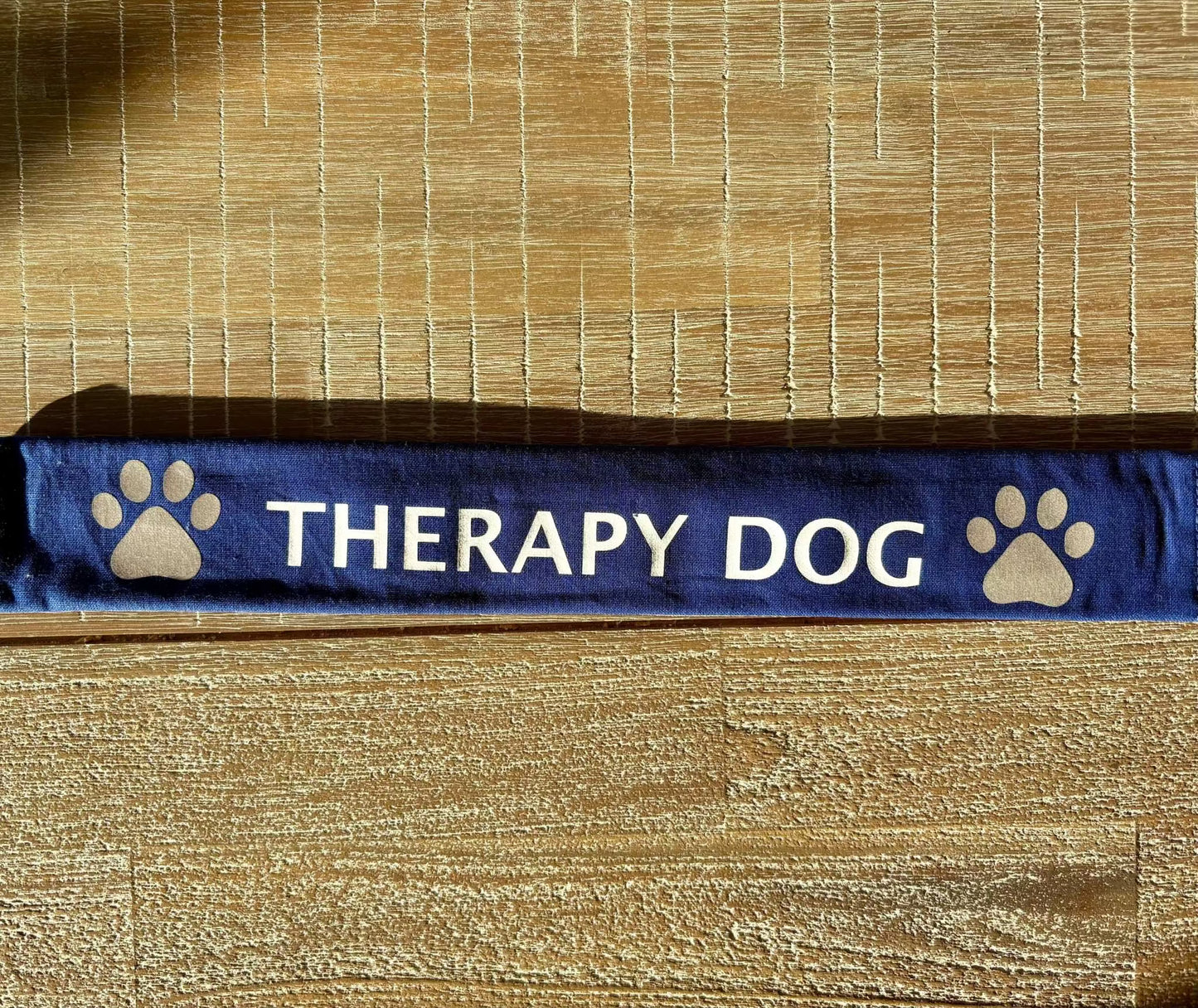 Blue therapy dog lead slip with reflective paw prints for dog safety and communication