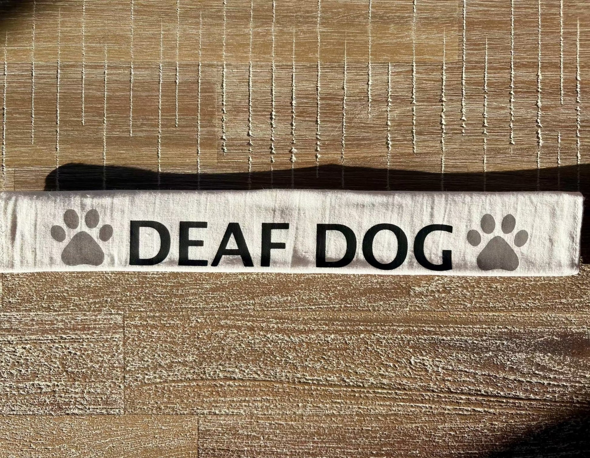 Cotton lead slip for dogs with "DEAF DOG" text and paw prints, designed for safety and communication