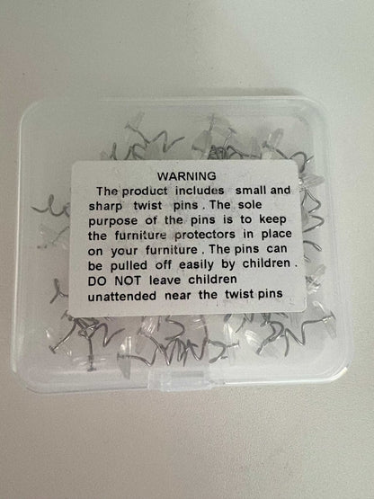 Clear plastic box of twist pins for Cat Scratch Deterrent Tape furniture protection with safety warning label