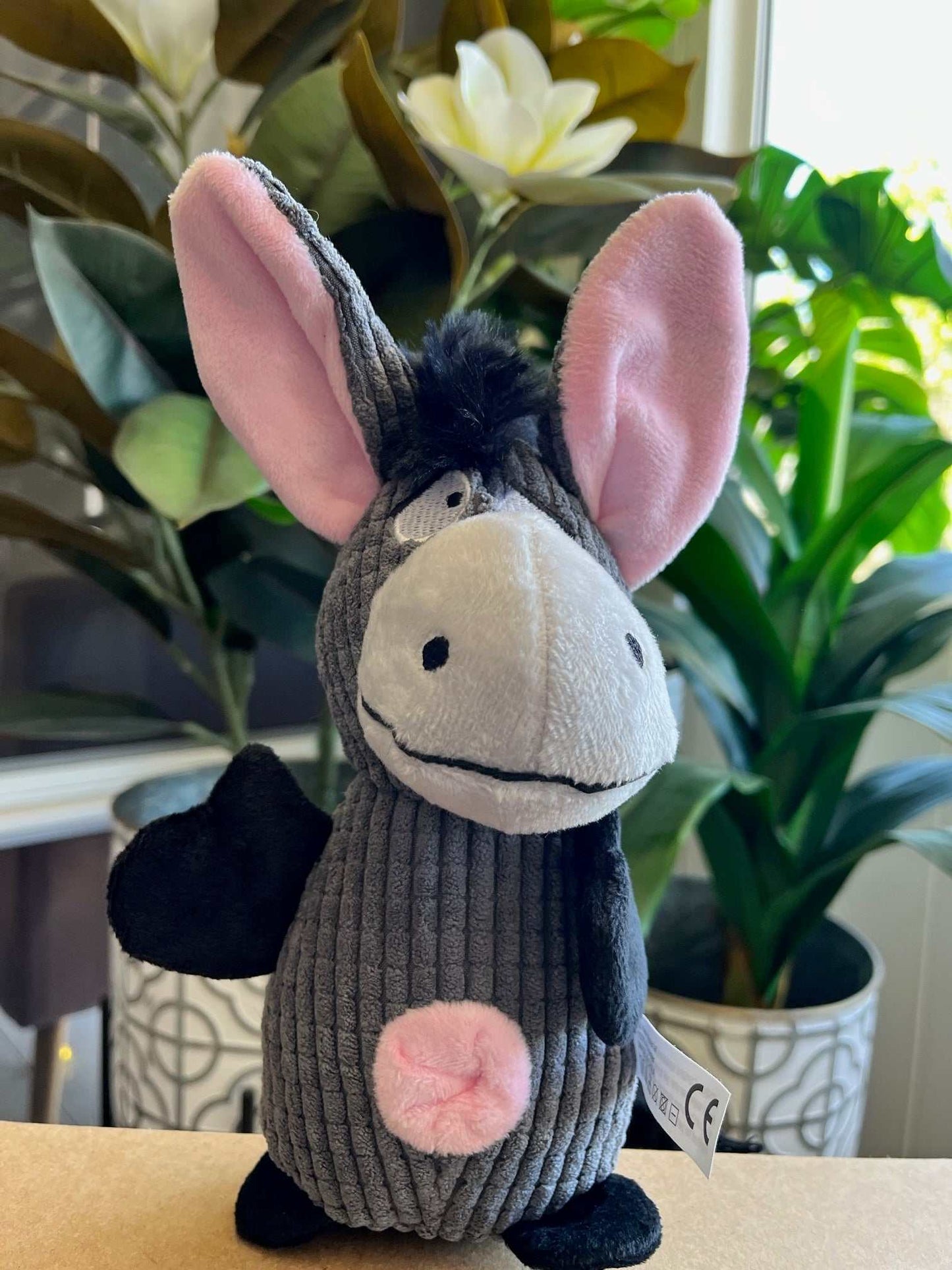 Interactive plush toy for dogs with squeaker and crinkle sounds, featuring donkey design, perfect for small to medium pets.