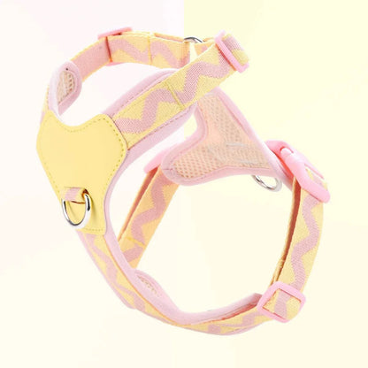 Pink and yellow printed ribbon dog harness with adjustable straps and padded interior for small to medium dogs