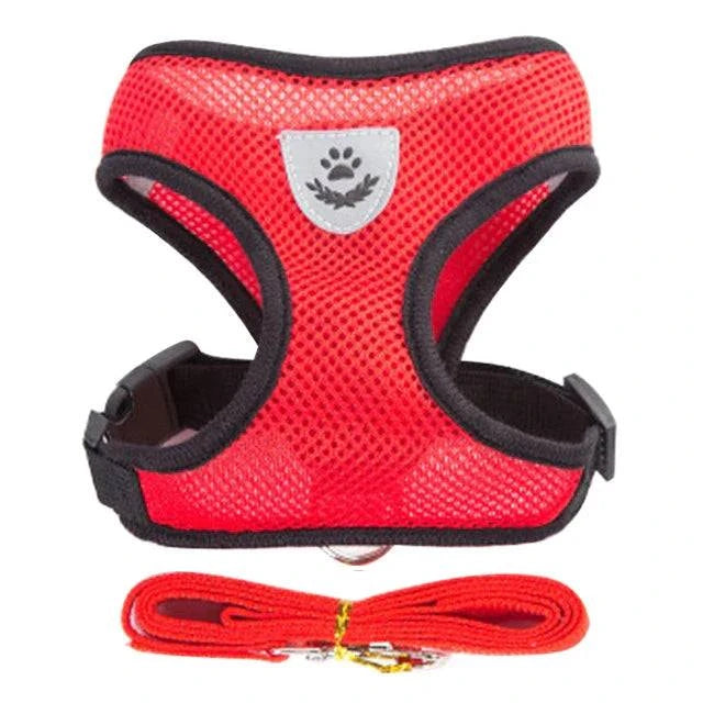 Red adjustable harness for cat or small dog with leash, soft breathable design.