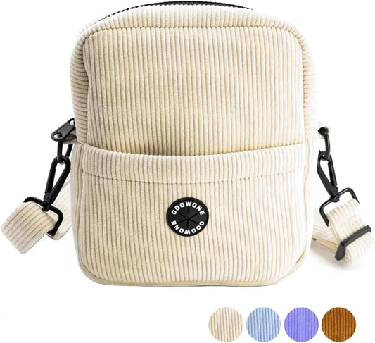 Corduroy velvet dog treat pouch with adjustable strap and built-in poop bag dispenser.