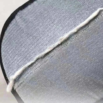 Close-up of eco-friendly Two-Way Pet Hair Removal Glove from Cat V’s Couch Defender Duo Bundle against gray couch fabric