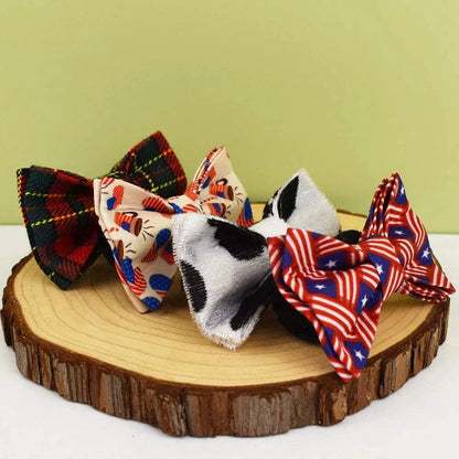 Personalised cat collars with adjustable bows in various patterns on display.