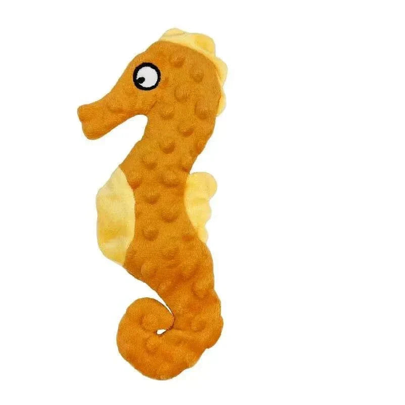 Orange seahorse-shaped no stuffing dog toy with squeaky and crinkle features.