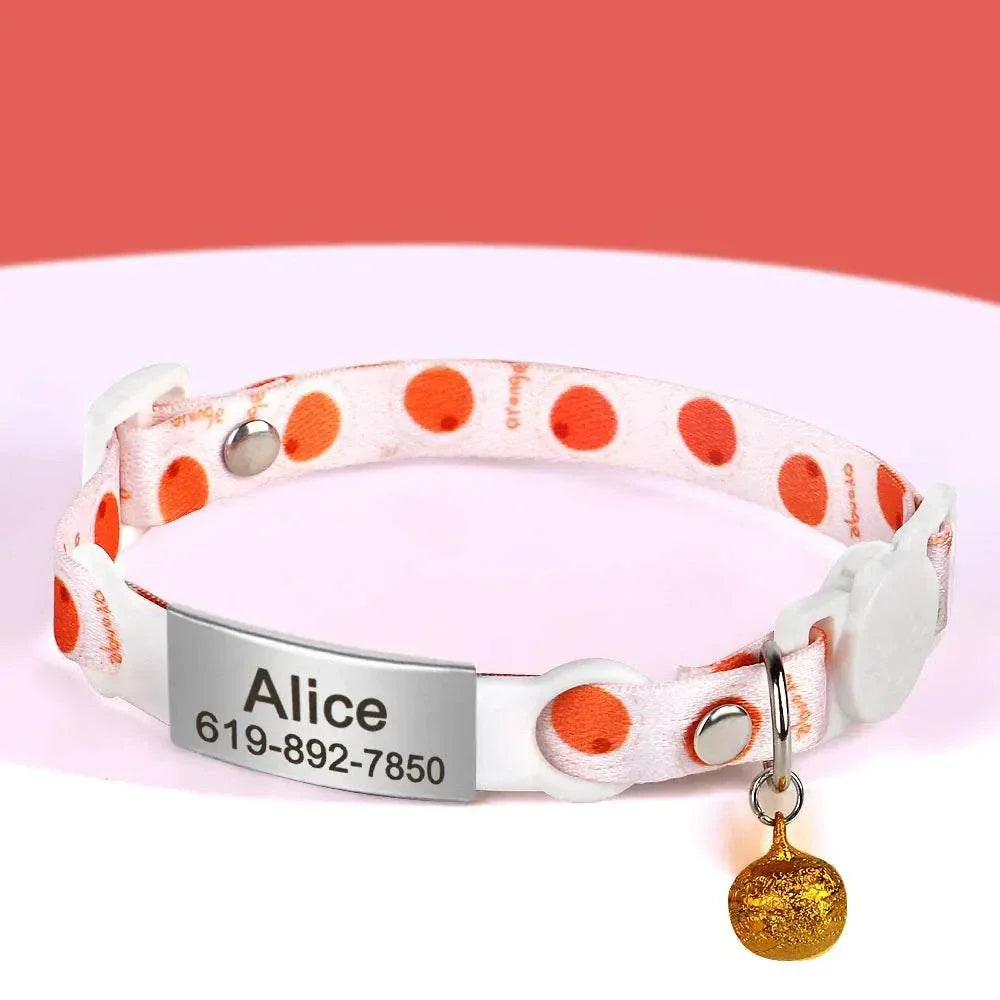 Personalised 1cm width cat collar with bell and breakaway design, featuring orange polka dots and engraved name tag.