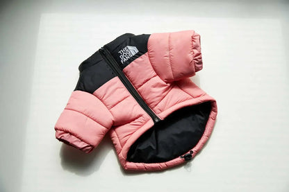 Winter down puffer jacket for dogs in pink and black with front zipper.
