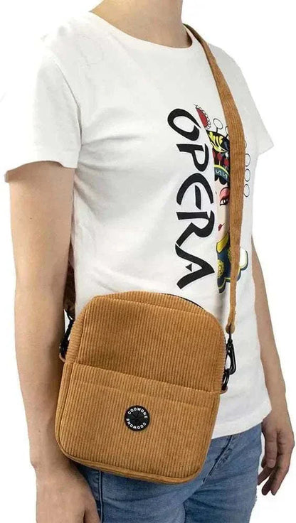 Corduroy velvet dog treat pouch with adjustable strap and built-in poop bag dispenser.