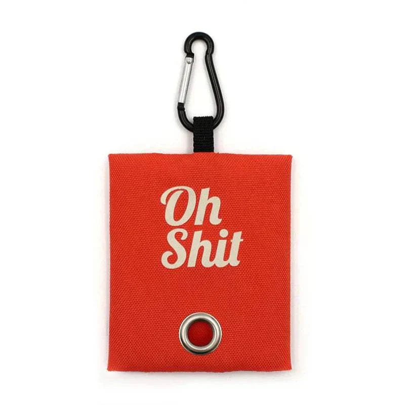 Red "Oh Sh!t" poop bag dispenser with carabiner attachment for dogs, made from durable canvas.