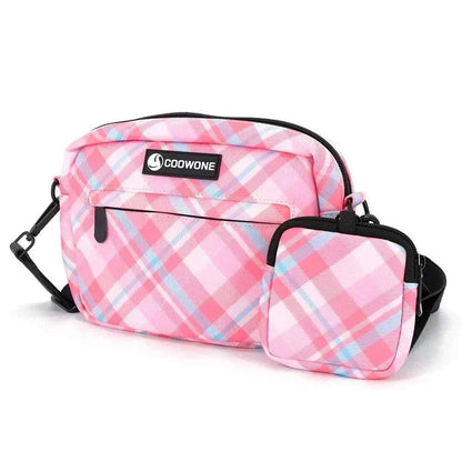 Waterproof pink dog training treat pouch with plaid design and built-in poop bag dispenser.