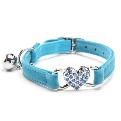 Pretty Kitty's adjustable blue cat collar with heart-shaped diamond and bell.