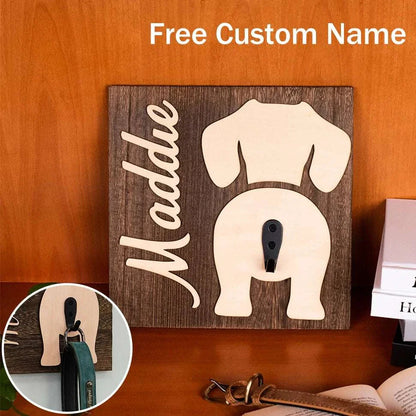 Personalised wooden dog leash rack with custom name engraving and metal hooks mounted on wall