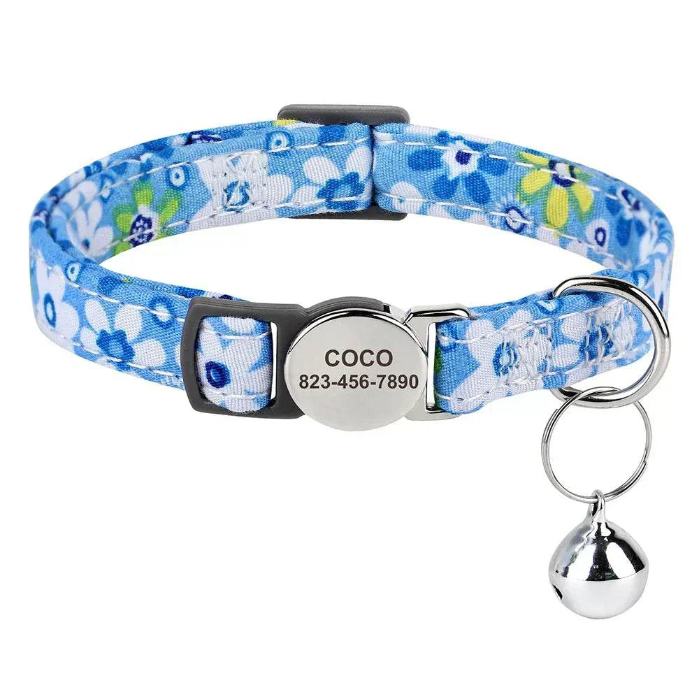 Personalised adjustable cat collar with blue floral design, custom ID nameplate, and bell.