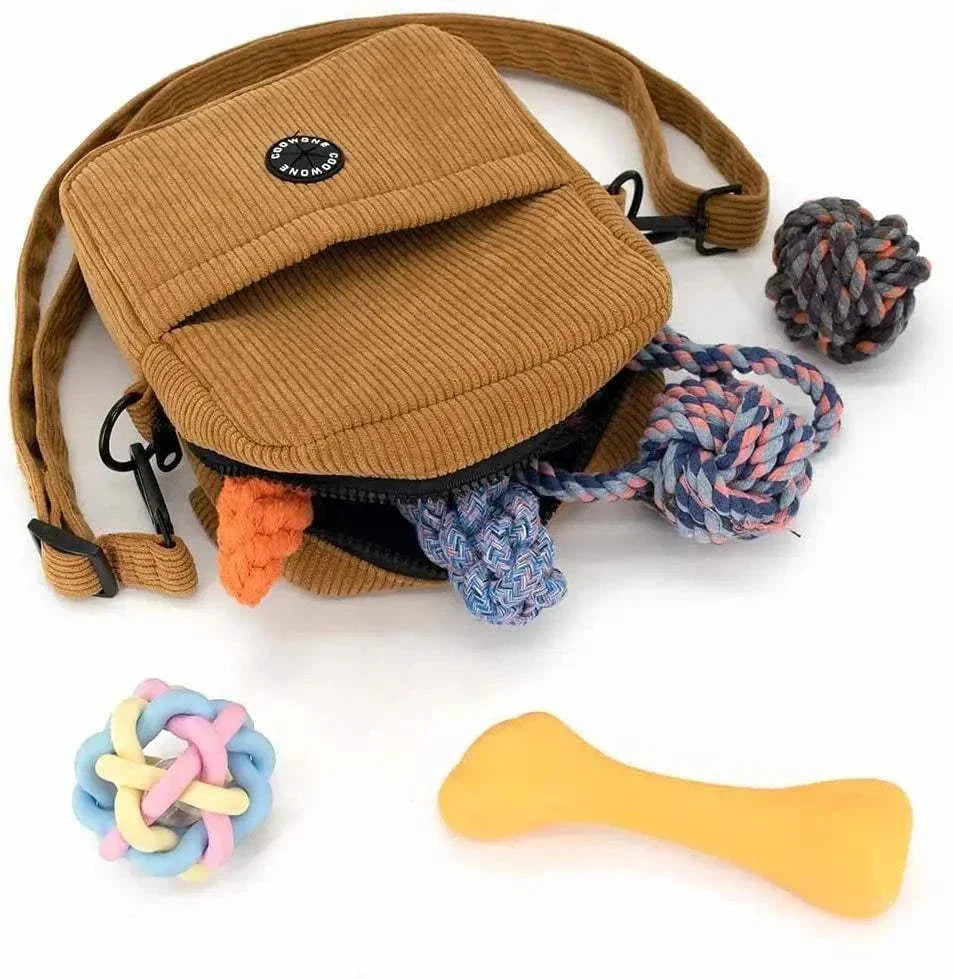 Corduroy velvet dog treat pouch with adjustable strap, built-in poop bag dispenser, and colorful dog toys.