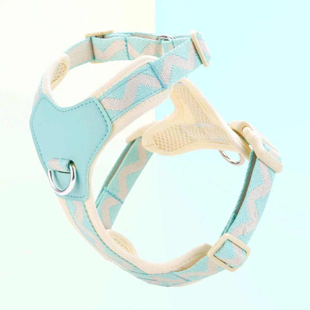 Light blue dog harness with adjustable straps and printed ribbon design for small to medium dogs