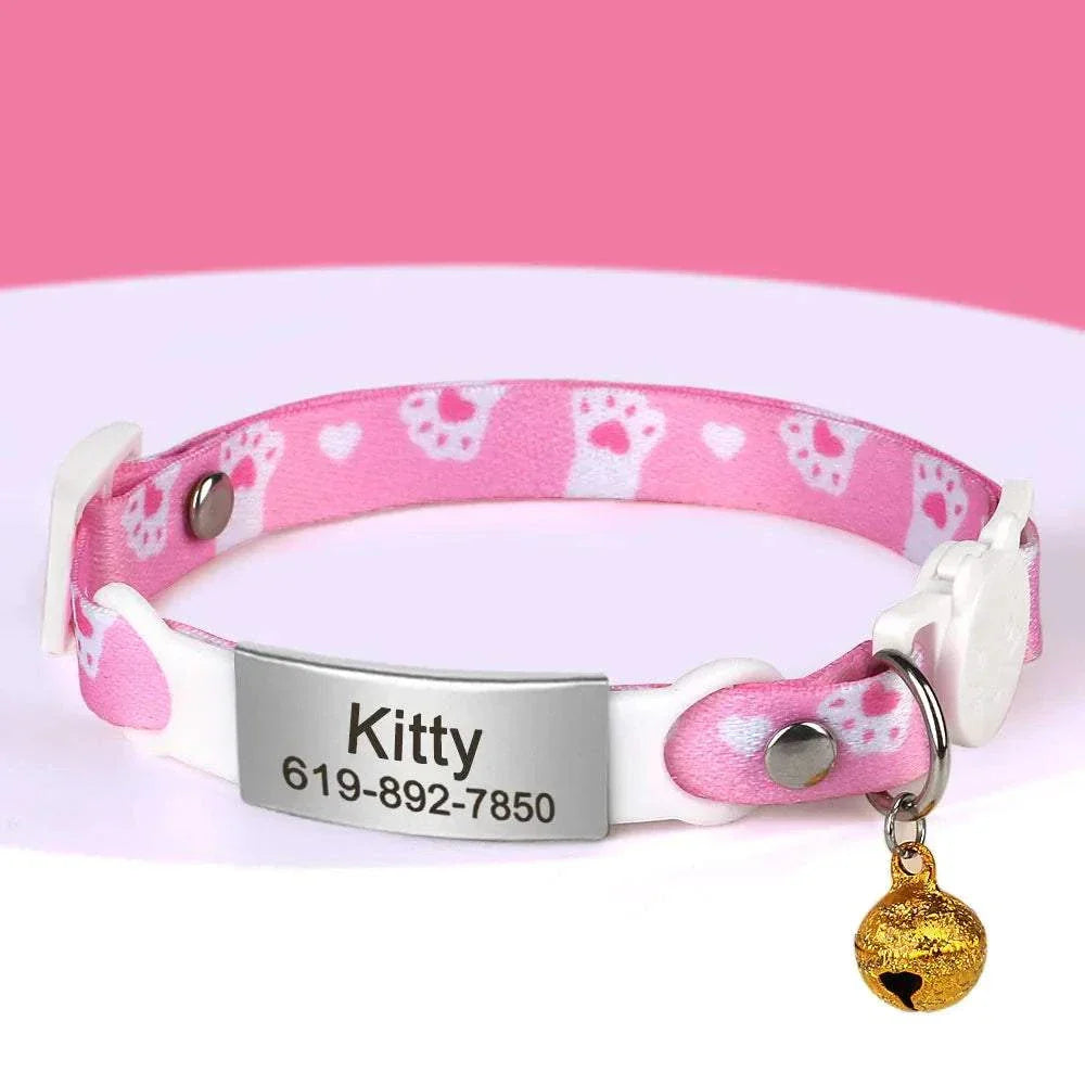 Personalised 1cm width cat collar with safety bell, breakaway design, and custom engraving in pink pattern.
