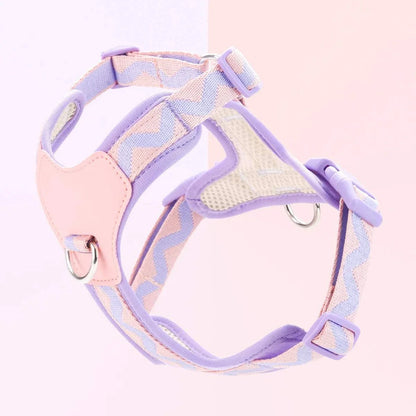 Small dog harness with pink and purple printed ribbon design and adjustable straps