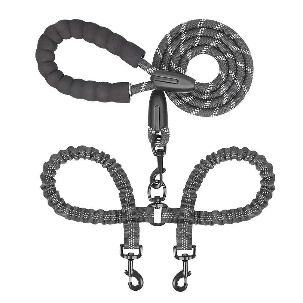Dual bungee rope leash for walking two dogs with shock-absorbing extension and comfort-grip handles